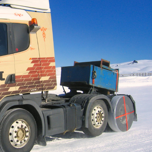 AutoSock installed on rear wheels of a truck without trailer, driving on snow