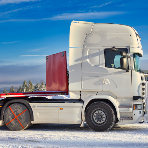 Side view of a mounted AutoSock, installed on rear wheels of a truck
